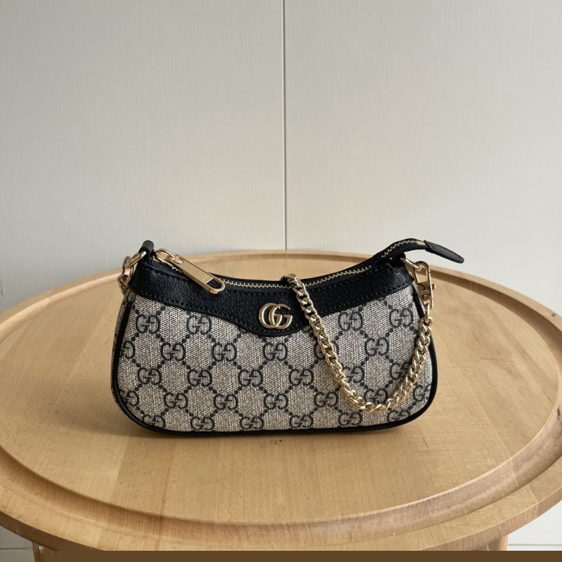 G*u*i top handle bags